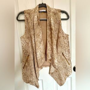 Calvin Klein vest with a snake print and gold zippers.size Small